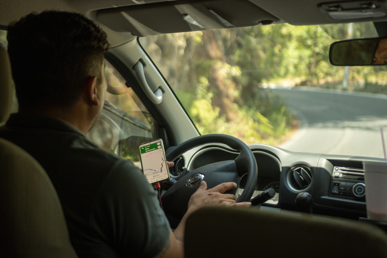 A driver using a GPS app to navigate the area
