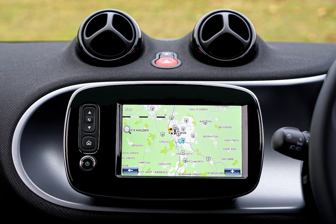 A map on a black GPS monitor in a car.