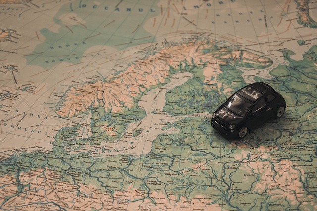A toy car on a physical world map.