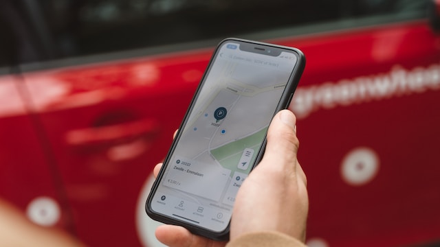 A man using Google Maps “Save parking” feature to locate his vehicle. 