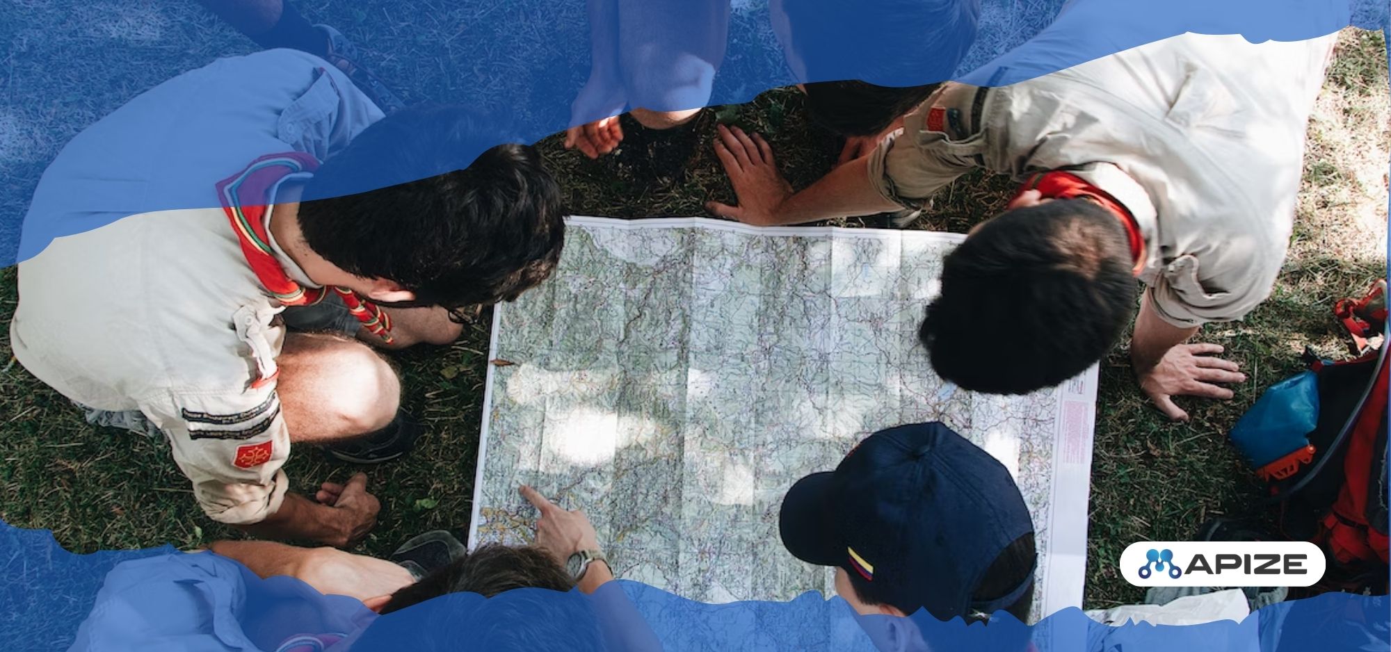 A group of people checking a physical map to understand different locations.