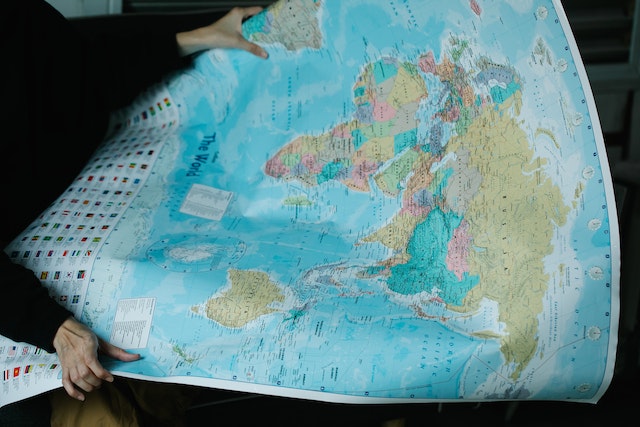 A user checking the content of a detailed world map. 