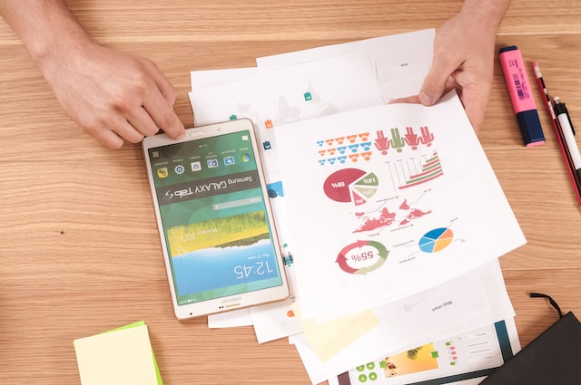 A user analyzing printed data from a data visualization tool.