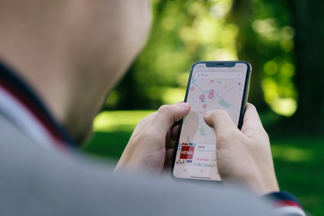 A user checks out multiple locations via a navigation app on his smartphone.