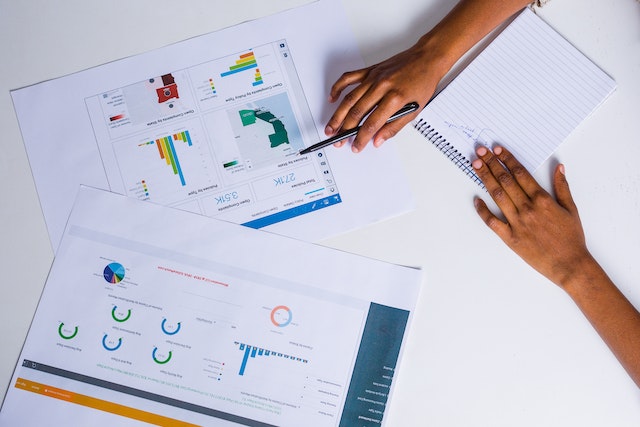 Two individuals drawing insights from visualized data.