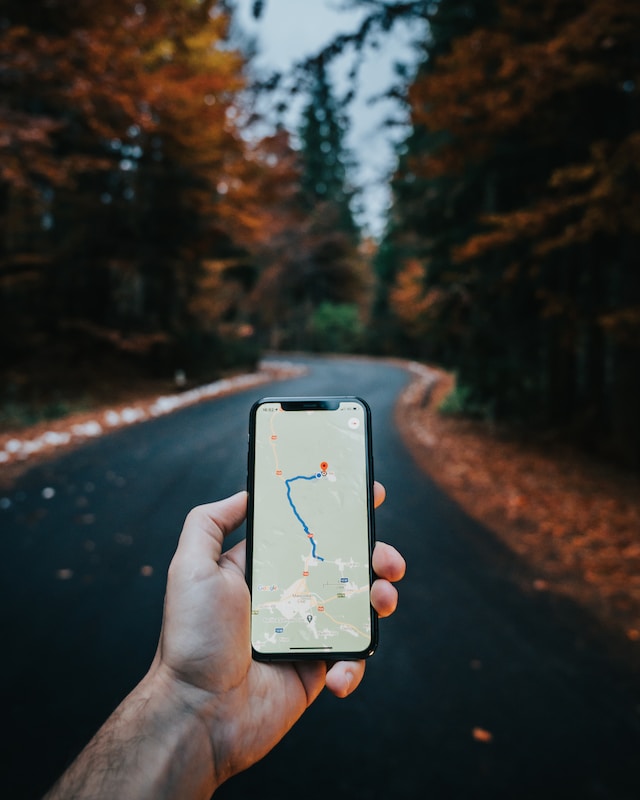 A person uses Google Maps to find the location of the closest ballpark.